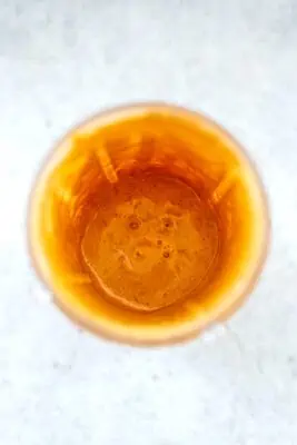 Carrot and Banana smoothie in blender cup after blending.