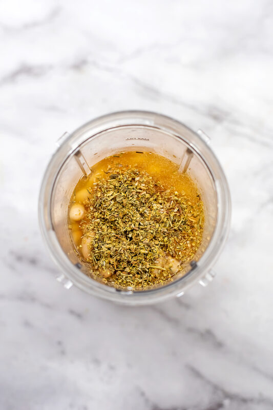 blender filled with the dairy free sauce ingredients for broccoli casserole.