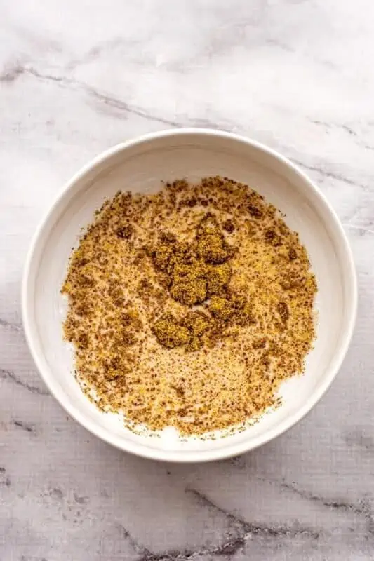 Ground flax added to dairy free milk and maple syrup.