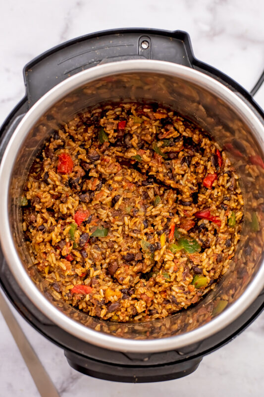 Instant pot Mexican rice and beans after cooking and stirring in defrosted bell peppers.