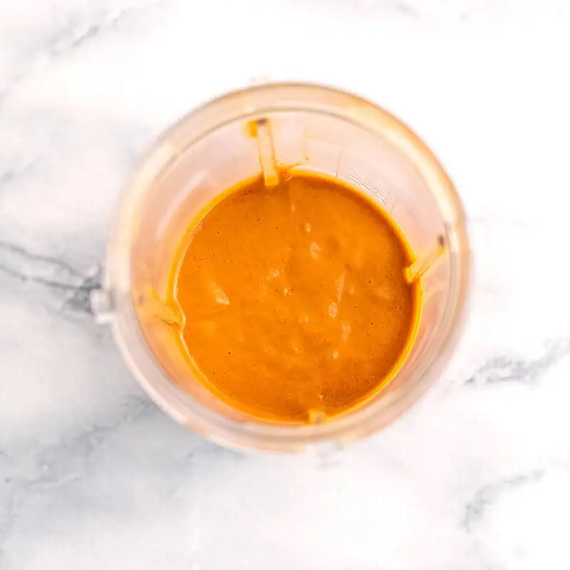 French dressing in a blender cup after blending.