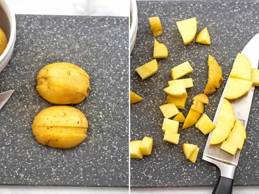 A potato cut in half then in 1/2 logs, then diced into cubes.