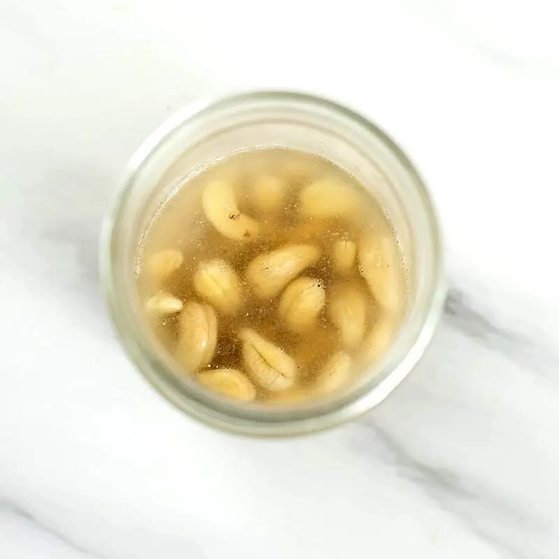 Cashews in glass after soaking for about 5 minutes.