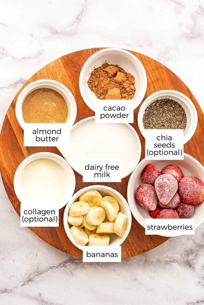 Ingredients to make strawberry banana chocolate smoothies in ramekins.