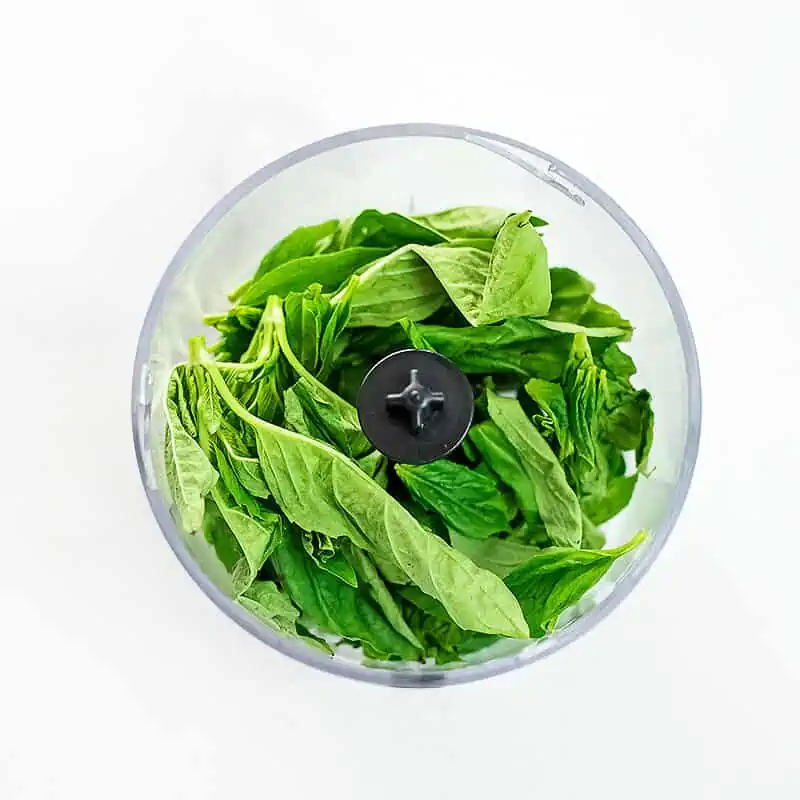 Basil, lemon juice, olive oil in a food processor.