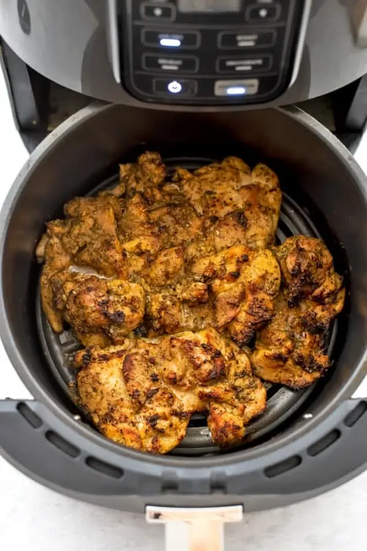 greek cihicken thighs in air fryer before flipping.