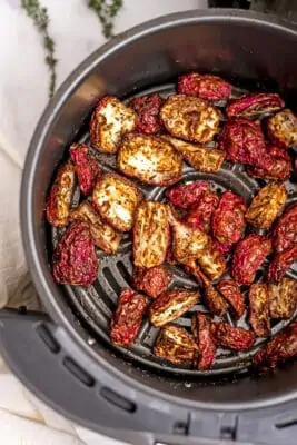 Roasted radish in air fryer basket.