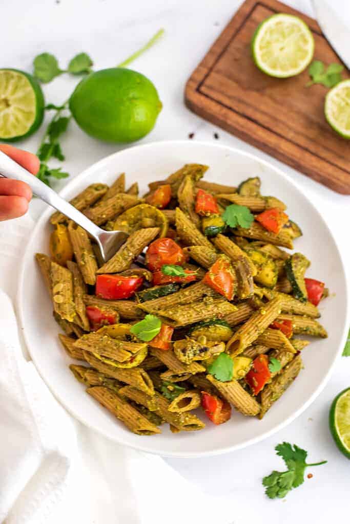 Fork in a bowl of chimichurri pasta