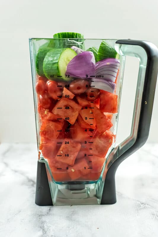 Watermelon tomato gazpacho ingredients in blender before blending.