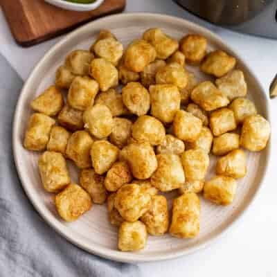 White plate with air fryer cauliflower gnocchi.