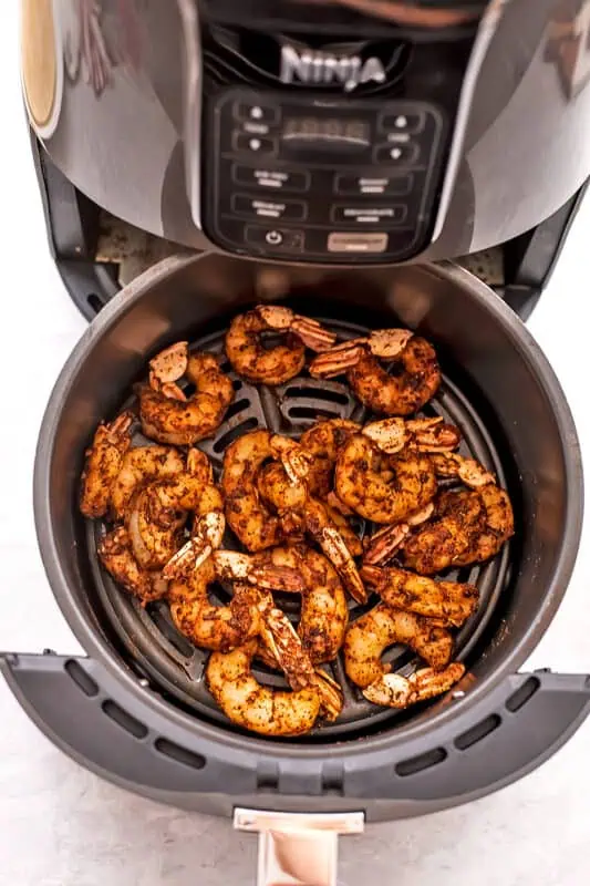 Taco shrimp in air fryer after cooking.