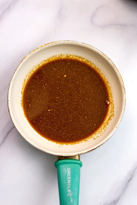 Teriyaki sauce in a skillet before cooking.