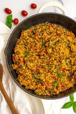 Italian cauliflower rice in cast iron skillet.