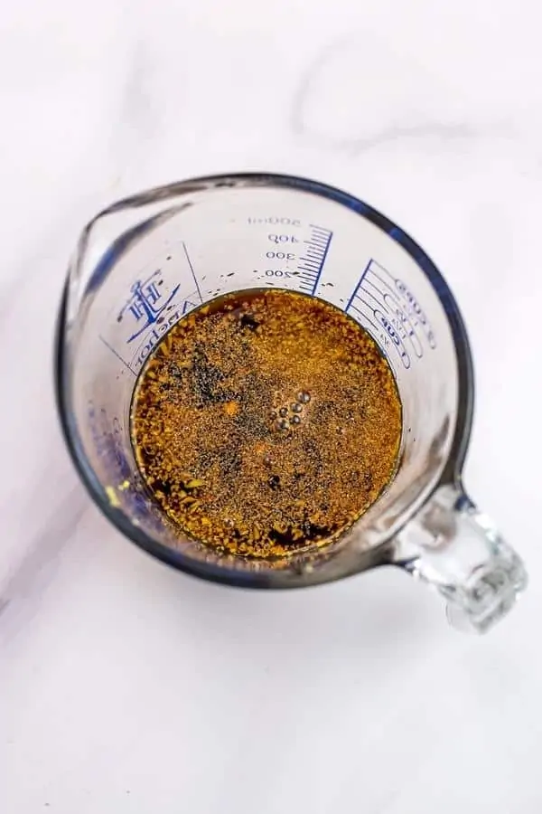 Homemade teriyaki marinade in a glass measuring cup.