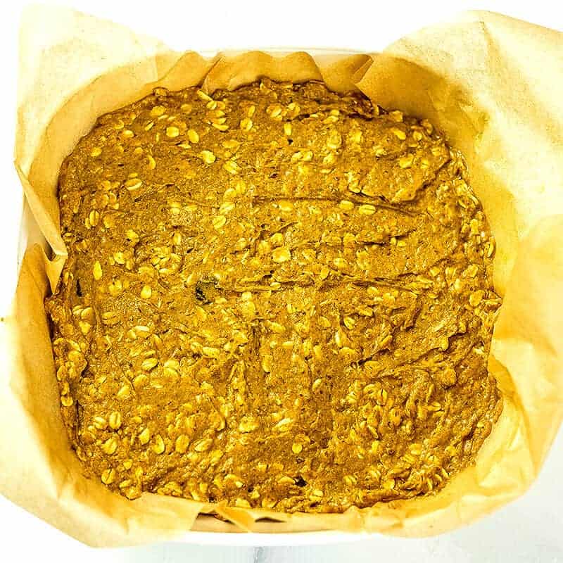 Pumpkin protein oatmeal in a baking dish before adding cranberries on top.