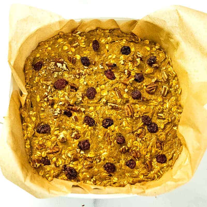 Cranberries and chopped pecans added to the top of the oatmeal mixture.