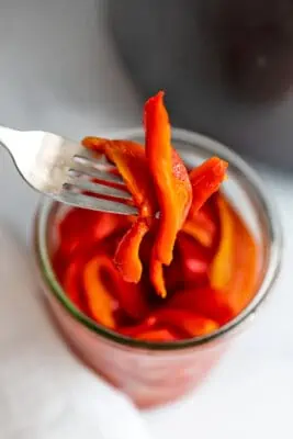 Forkful of thinly sliced air fryer roasted red peppers.