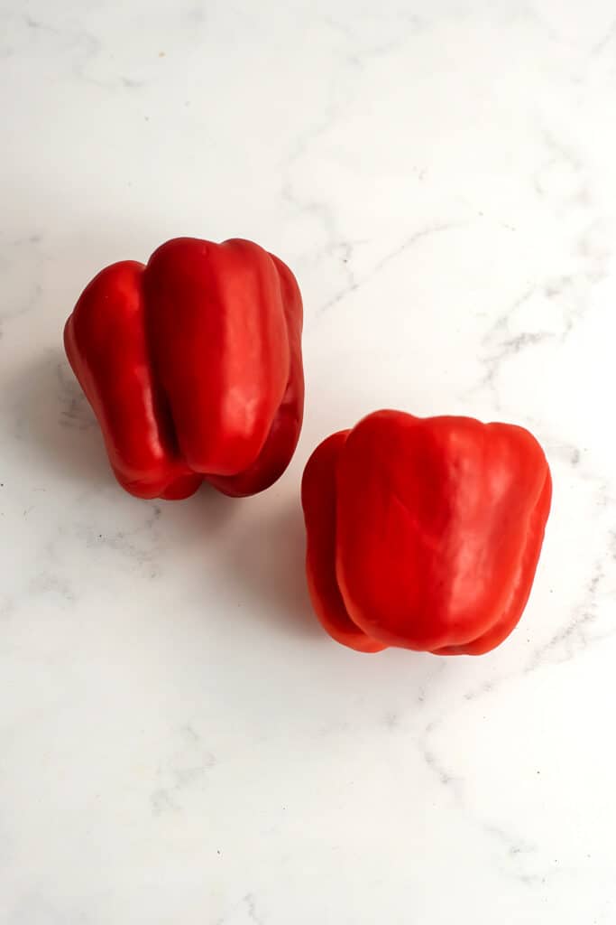 Two red bell peppers.