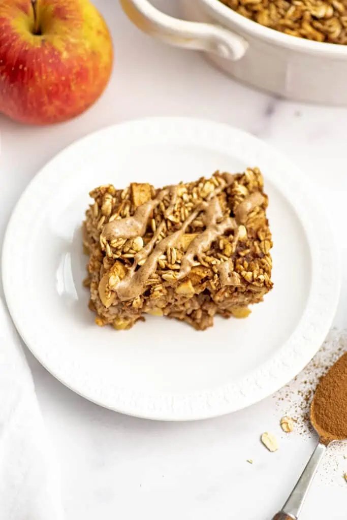 Almond butter drizzled over top of apple baked oatmeal.