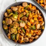 Large gray bowl filled with chicken apple sausage sheet pan meal.