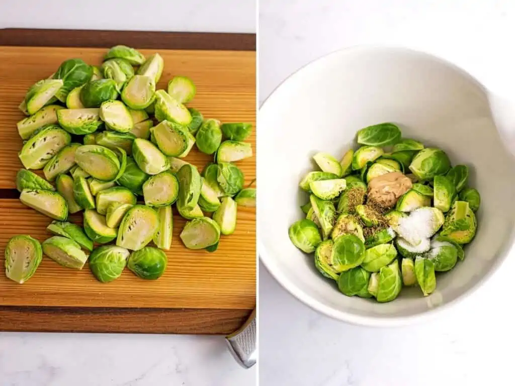 Brussel sprouts cut in half or quarters on a wooden cutting board.