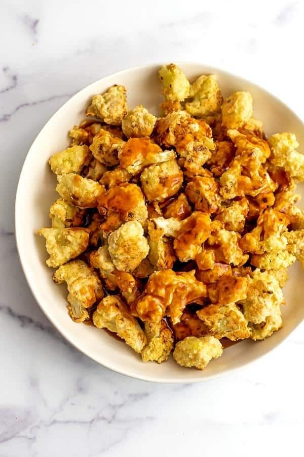 Sweet and sour sauce poured over crispy roasted cauliflower.
