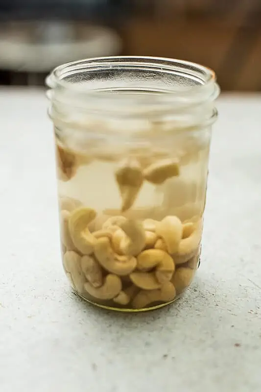 Cashews soaking in a mason jar.