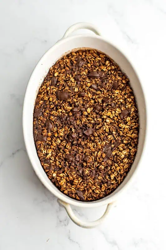 Chocolate baked oats in a white casserole dish after baking.