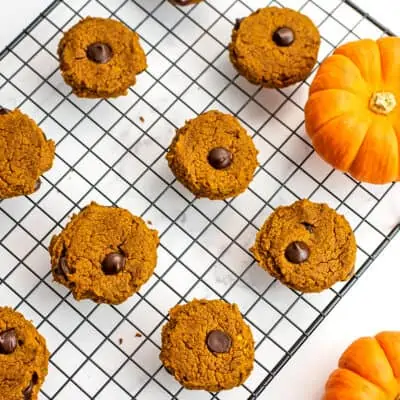 Wire rack with oat flour pumpkin cookies on top.