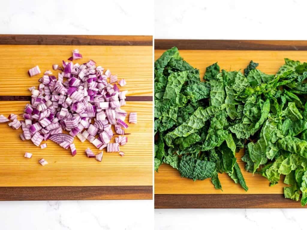 Chopped onion and chopped kale on wooden cutting board.