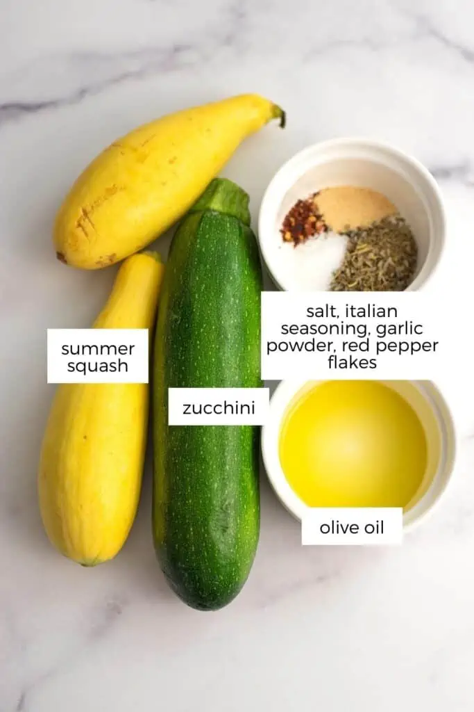 Zucchini and squash with ramekins filled with ingredients.