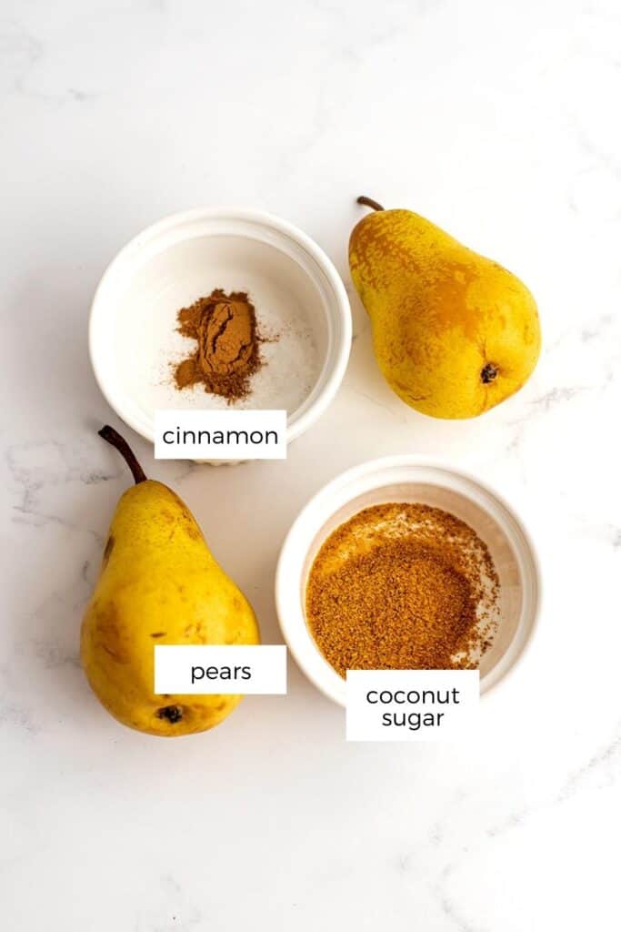 Ingredients to make air fryer pears on marble countertop.