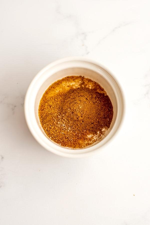 Cinnamon sugar mixture in white bowl.
