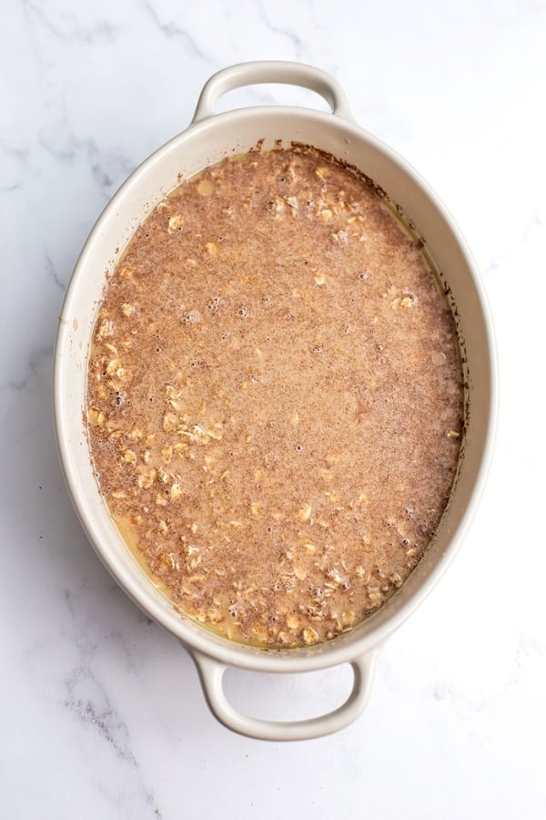 Cinnamon baked oatmeal in a white casserole dish.