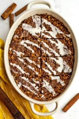 Cinnamon bun baked oatmeal cut into 8 slices.