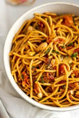 Tuscan white bean pasta in a large white bowl.