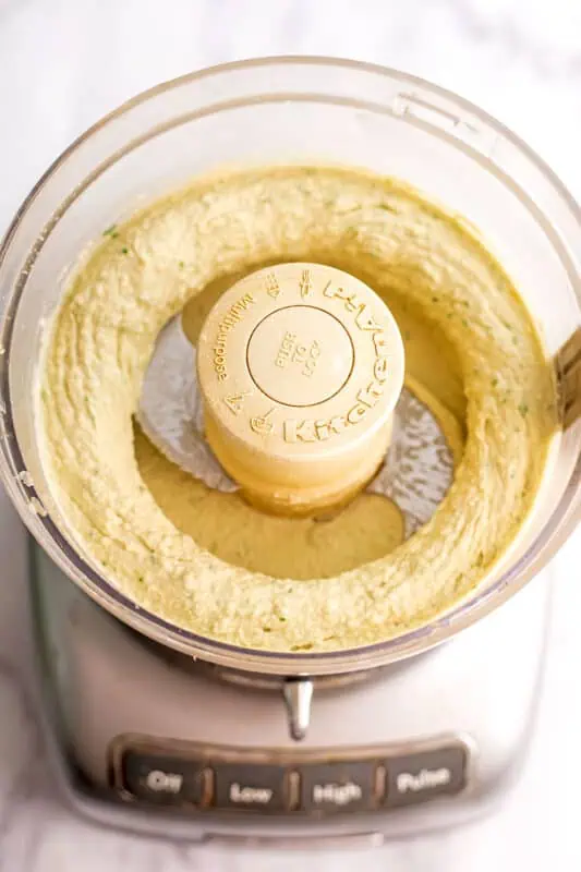 Butter bean hummus in food processor after blending.
