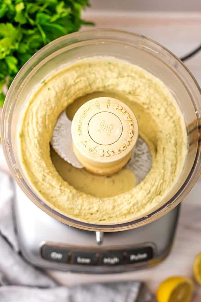 Food processor filled with lima bean hummus.