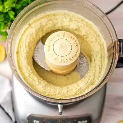 Lima bean hummus in a food processor.