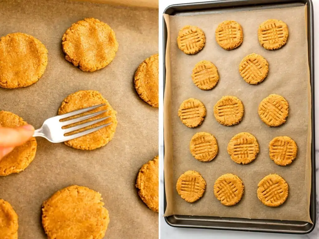 Fork flattening out peanut butter cookies on a parchment paper lined baking sheet.