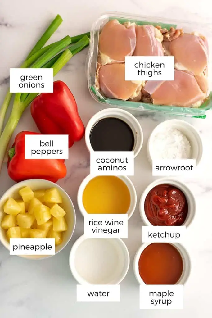 Ingredients to make sweet and sour chicken in white ramekins.