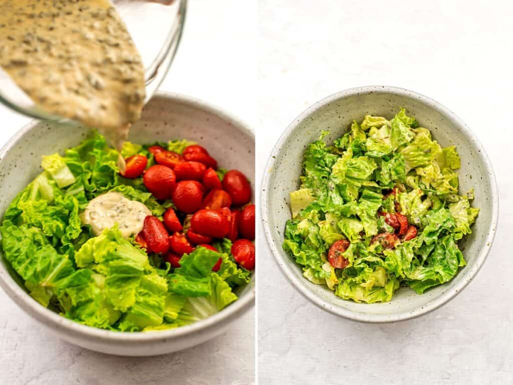 Tahini ranch dressing being added to lettuce and tomato in white bowl.
