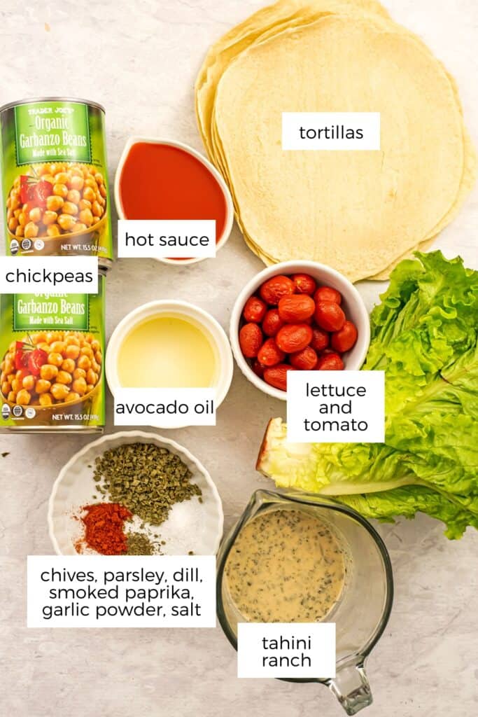 Ingredients to make buffalo chickpea wraps in bowls.