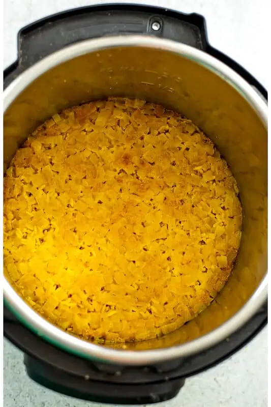 Instant pot yellow rice after cooking before fluffing the rice.
