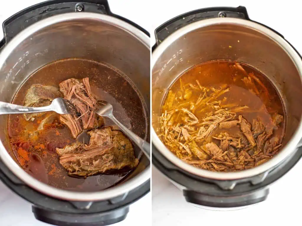 Two forks shredding beef in the instant pot.