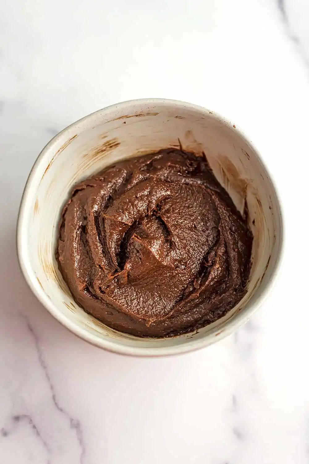 Chocolate tahini spread in a bowl after mixing.