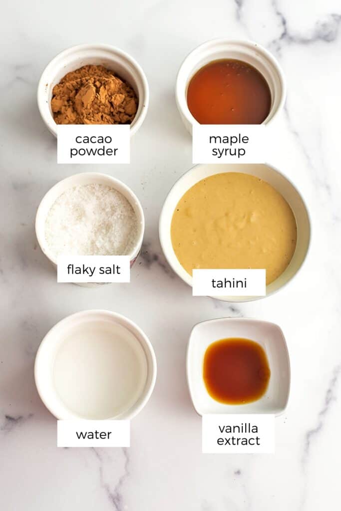 Ingredients to make chocolate tahini dip in white ramekins.