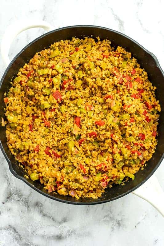 Dirty cauliflower rice in skillet after cooking.