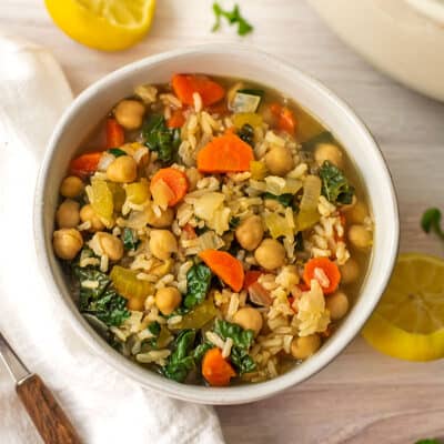 White bowl filled with lemon greek chickpea soup.