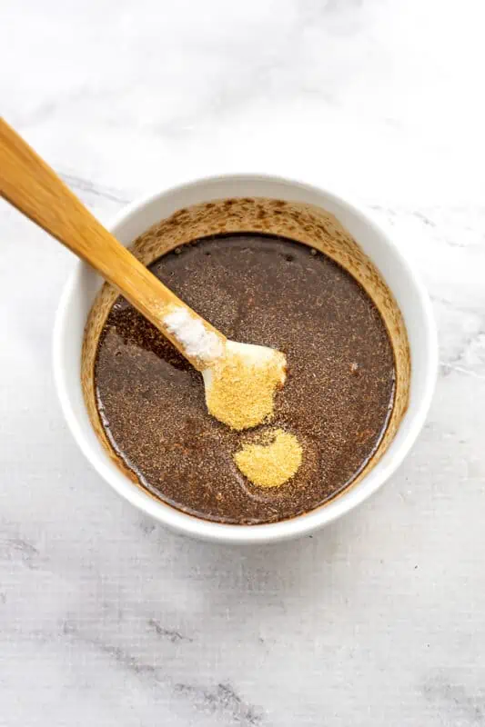 Large ramekin with a balsamic sauce, garlic powder added but not yet stirred in.